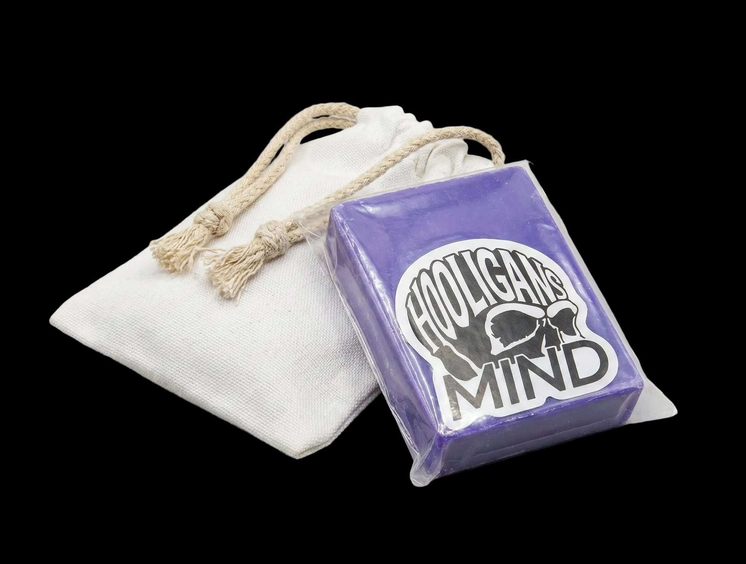 Purple block of wax with 'Hooligan Mind' logo on a white drawstring bag against a black background
